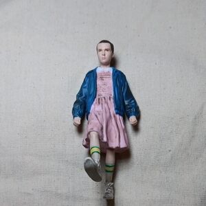 Netflix Action Figure with Blue Jacket and Pink Dress